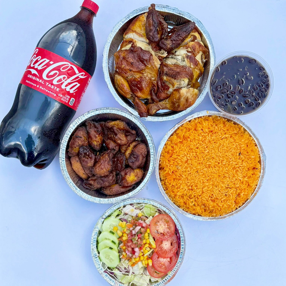 Takeout spread featuring roasted chicken, fried plantains, jollof rice, black beans, salad, and a bottle of Coca-Cola.